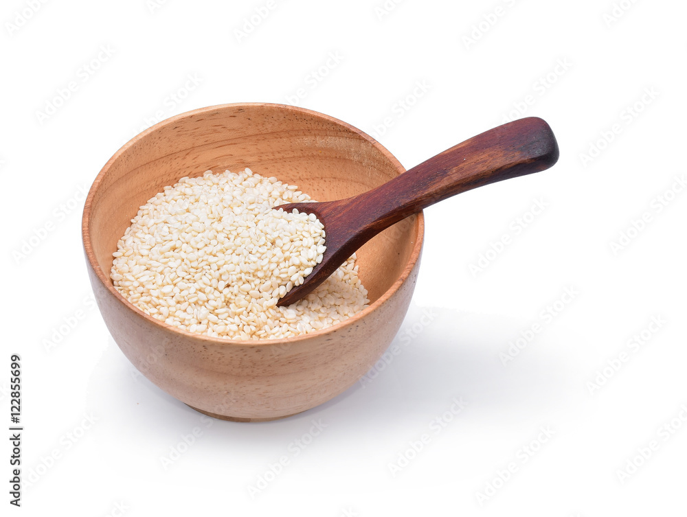white sesame in wooden bowl on white background white sesame in wooden bowl on white background