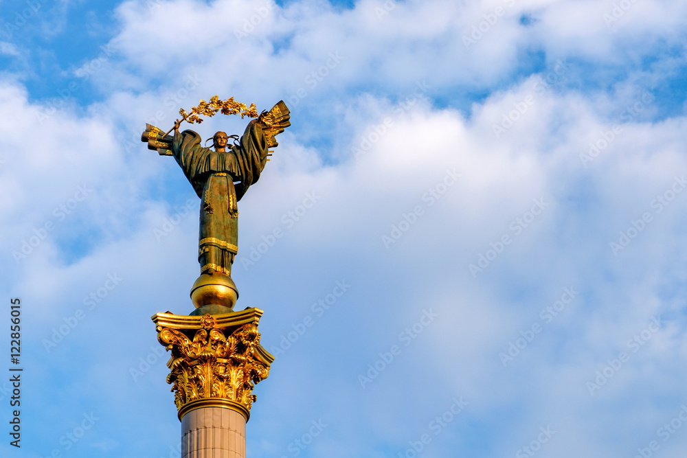 Famous statue on a column in Kiev, Ukraine. Bereginia (or Berehynia) stands on Maidan Nezalezhnosti (Independence Square) as a symbol of Ukrainian freedom. Famous statue on a column in Kiev, Ukraine. Bereginia (or Berehynia) stands on Maidan Nezalezhnosti (Independence Square) as a symbol of Ukrainian freedom.
