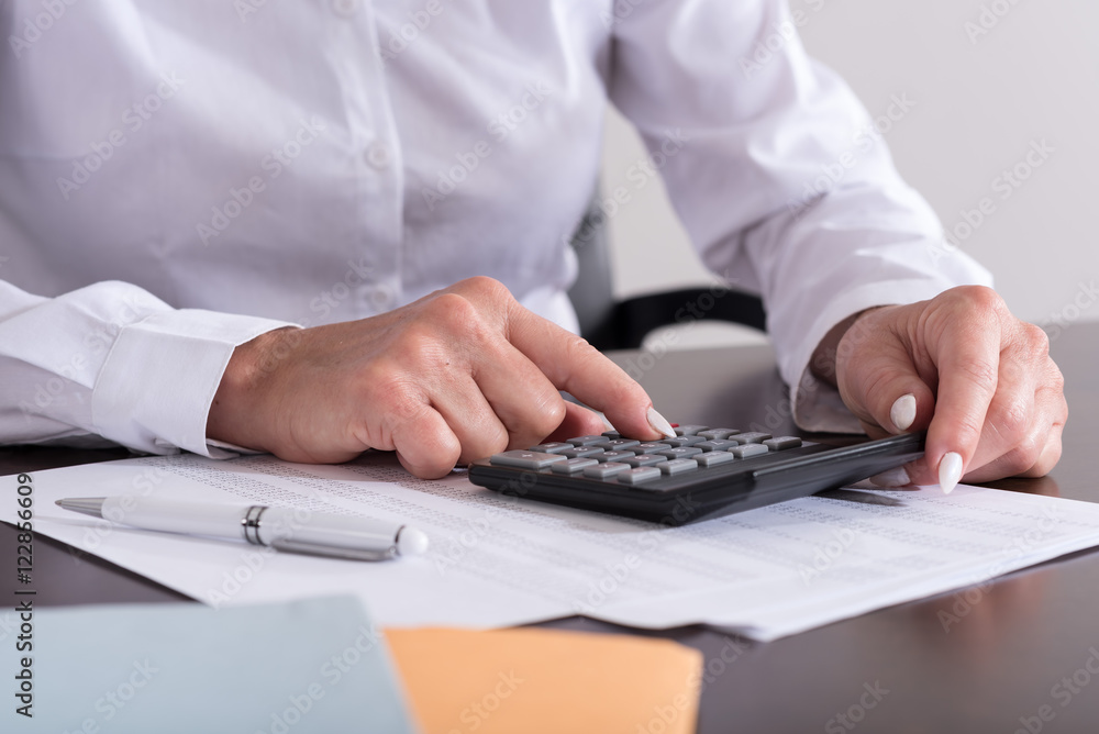 Woman doing her accounting Woman doing her accounting