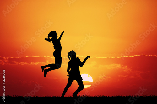 girls in joy at sunset