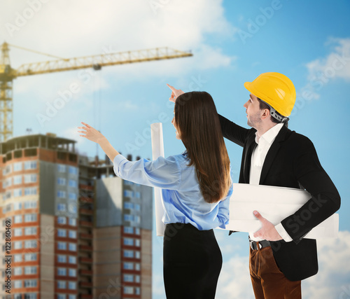 Woman and engineer in vest ...