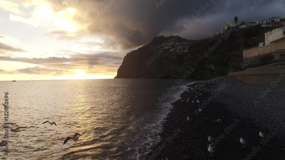 beach of Camara De Lobos, Madeira at sunset beach of Camara De Lobos, Madeira at sunset