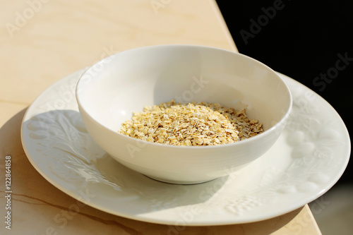 Cereal oat flakes in bowl