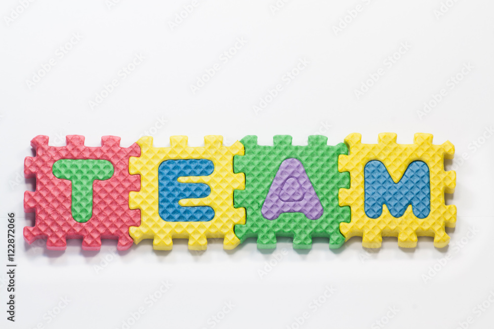 Puzzle pieces with word team on a white background. Puzzle pieces with word team on a white background.