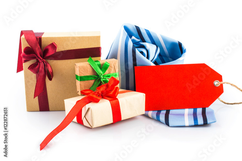 Blue in a black and white striped twisted tie, with red price tag. Gift boxes with bows and ribbons. On white, isolated  background. © redfox331