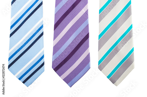 Three variants of a striped tie in colorful stripes. On white, isolated background. Top view. Flat lay.