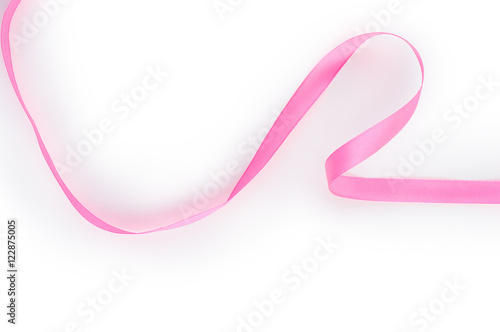 Pink satin ribbon isolated on white background. Top view. Flat lay.