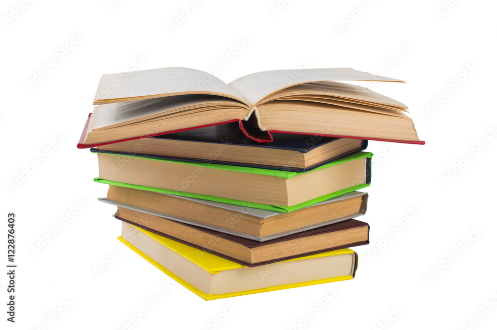 stack of multicolored books. One open. on white, isolated background. stack of multicolored books. One open. on white, isolated background.