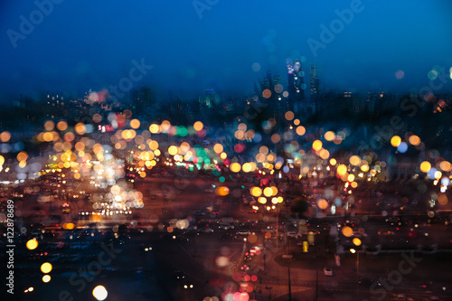 A blurred picture of a night city in the rain