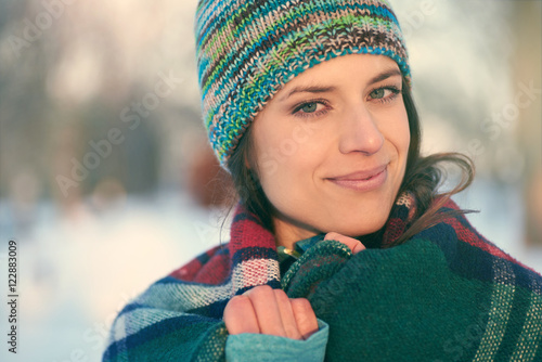 Attractive mixed race woman smilling in the snow photo