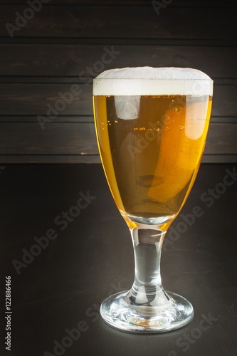 glass of beer on dark background. mug of beer on dark background. 
