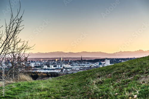 skyline of Linz, Austria with mountains at sun dawn