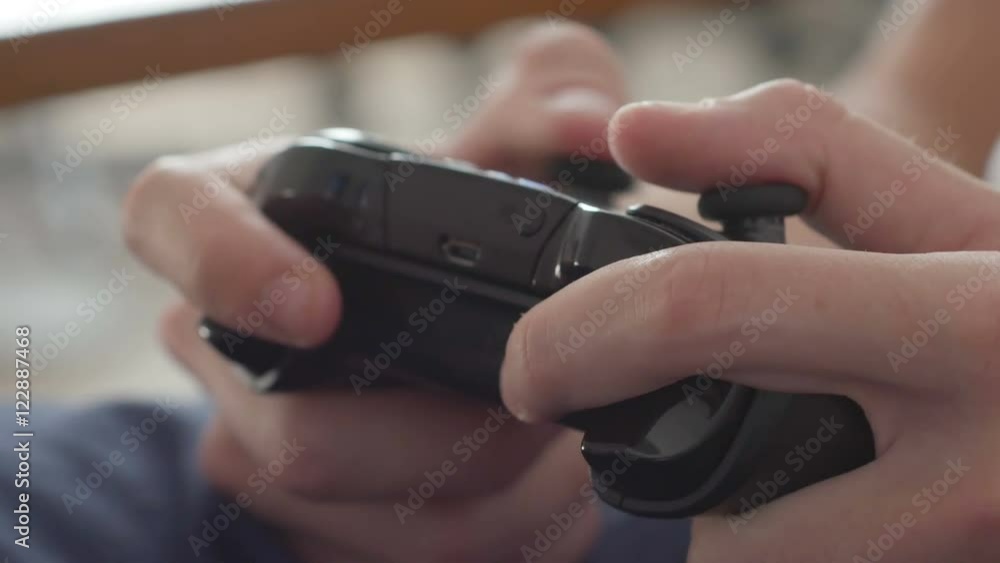 Close up of boy hands using game controller, in the end throwing the controller, angry close up Close up of boy hands using game controller, in the end throwing the controller, angry close up