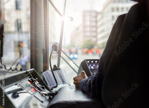 Inside a tram with driver and dashboard in sunset