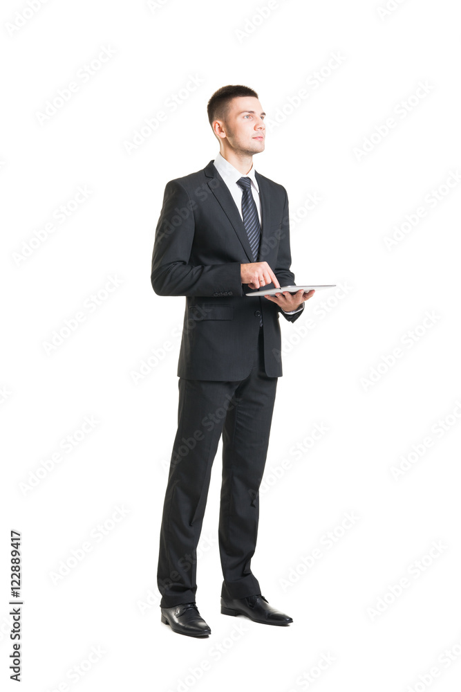 Young and confident business man holding a tablet Young and confident business man holding a tablet