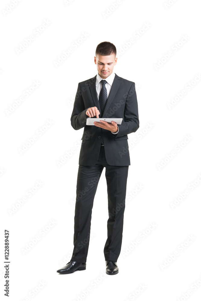 Young and confident business man holding a tablet