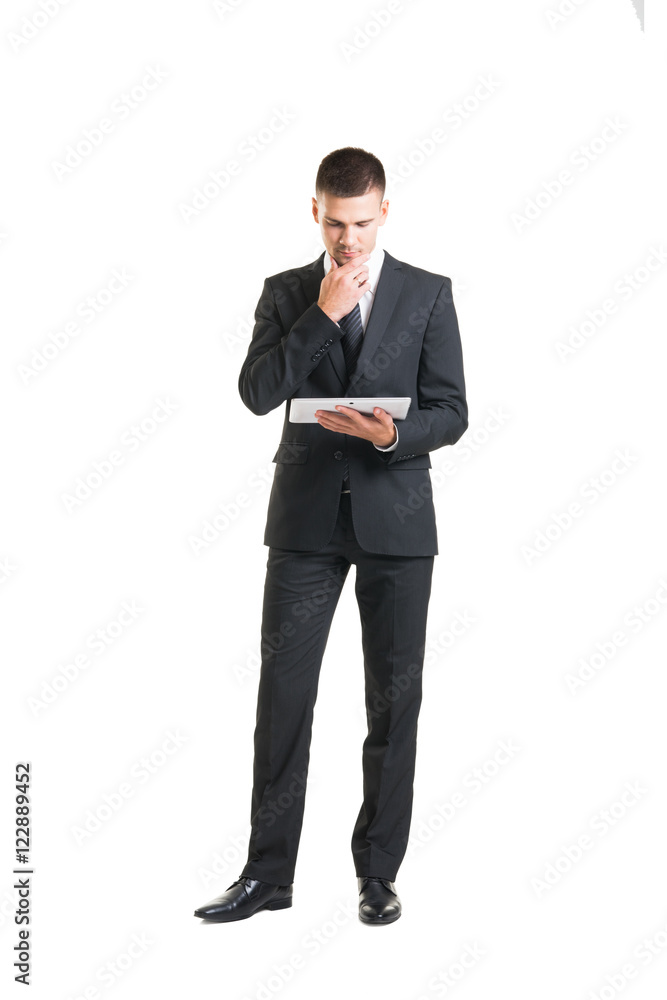 Young and confident business man holding a tablet Young and confident business man holding a tablet