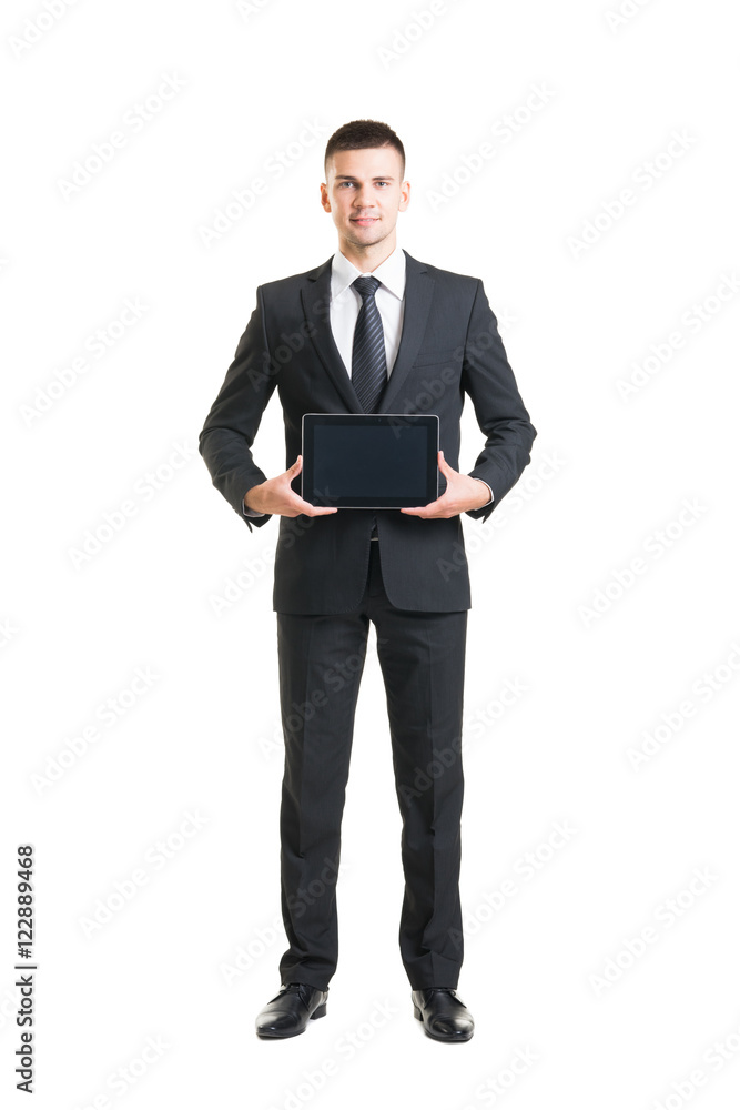 Young and confident business man holding a tablet Young and confident business man holding a tablet