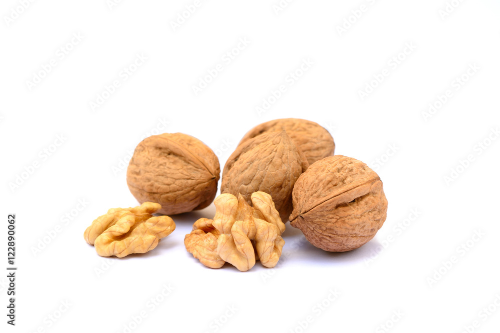 Pile of walnuts in shell isolated with white background Pile of walnuts in shell isolated with white background