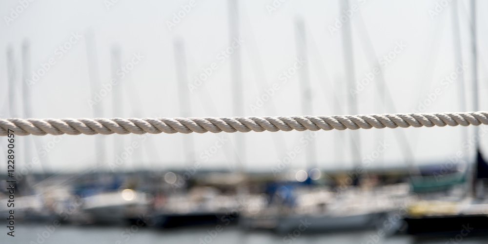 Rope with sailboats at marina in background, Spinnakers Landing,