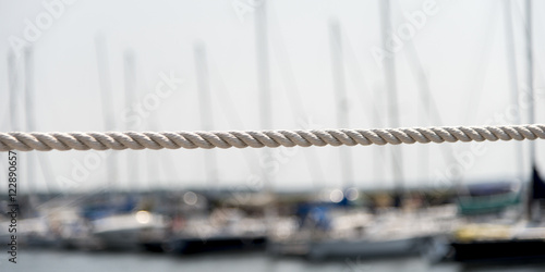 Rope with sailboats at marina in background, Spinnakers Landing,