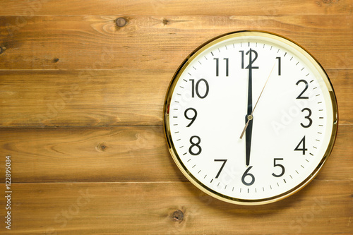 wall clock on the wooden wall