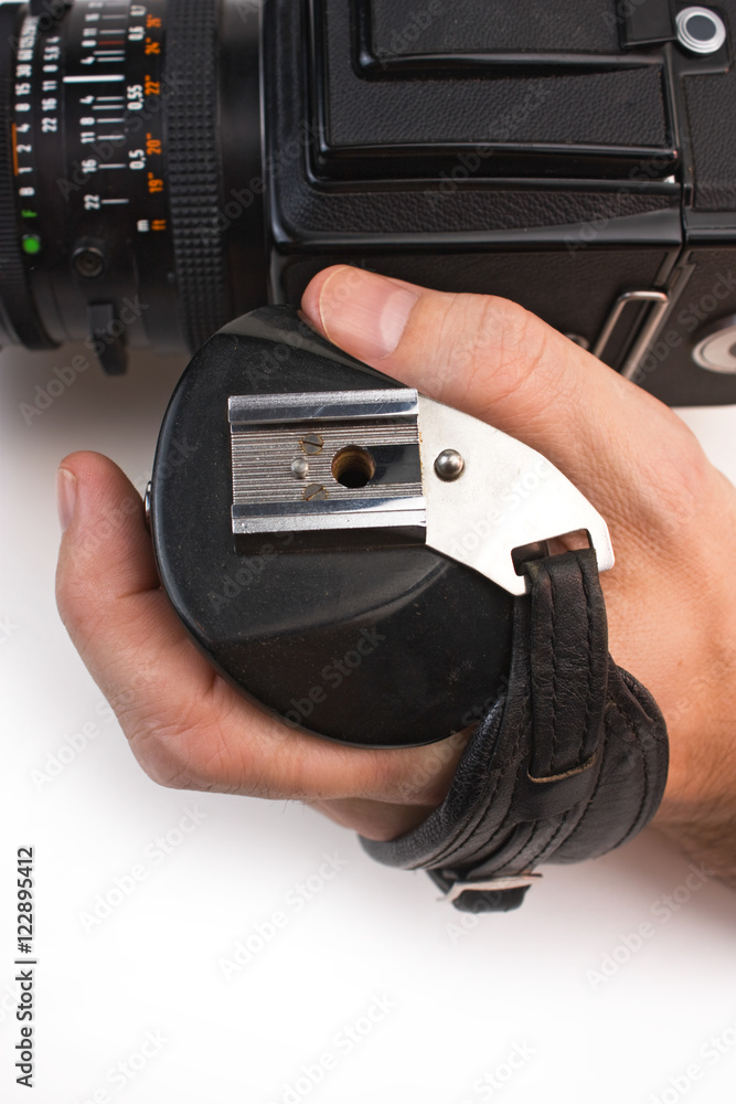 hand holds the handle of the camera hand holds the handle of the camera