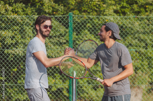 Tennis players shaking hands 