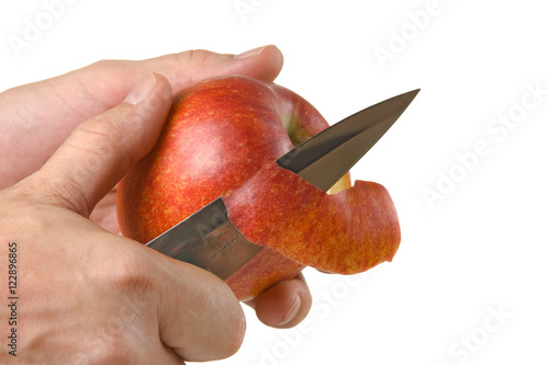 cutting peel an apple with a knife