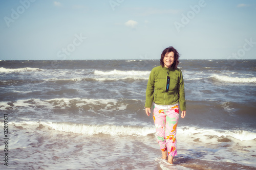 Joyful woman on the beach