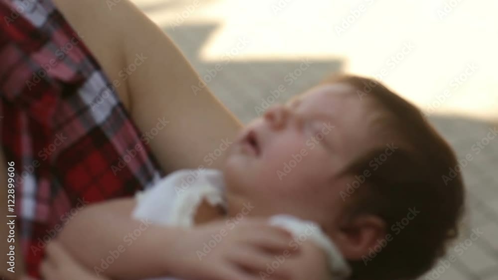 Baby sleeping on mother's hands Baby sleeping on mother's hands