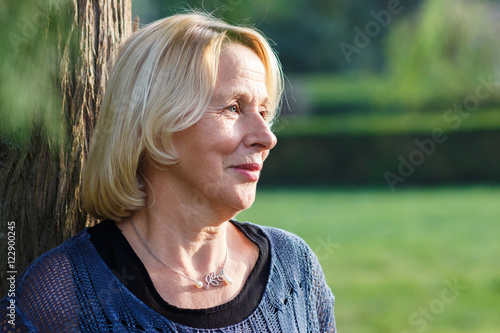 Portrait of senior woman in park. photo