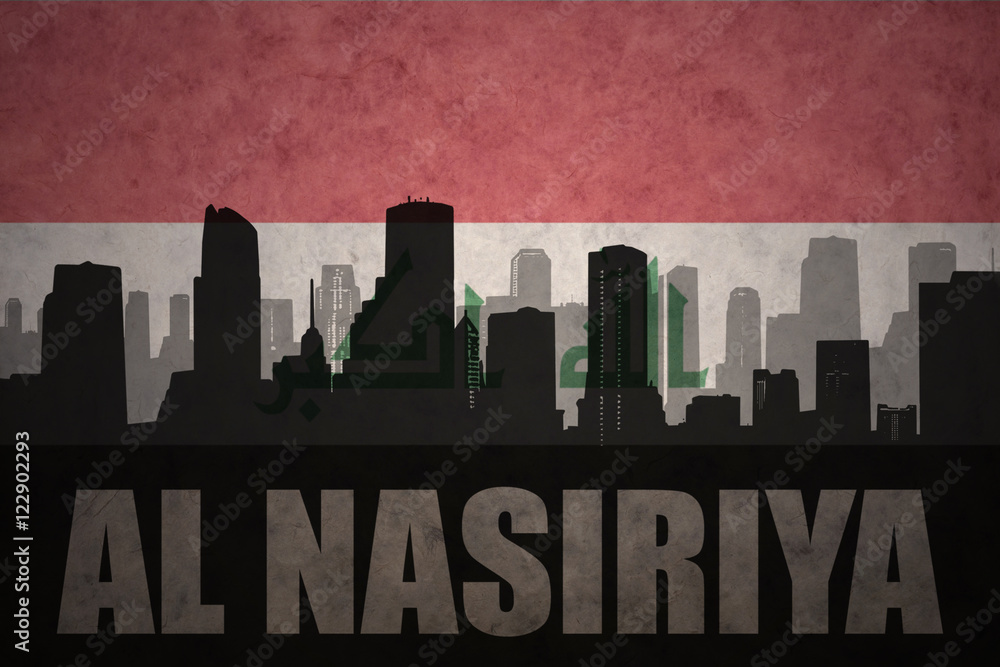 abstract silhouette of the city with text Al Nasiriya at the vintage iraqi flag background