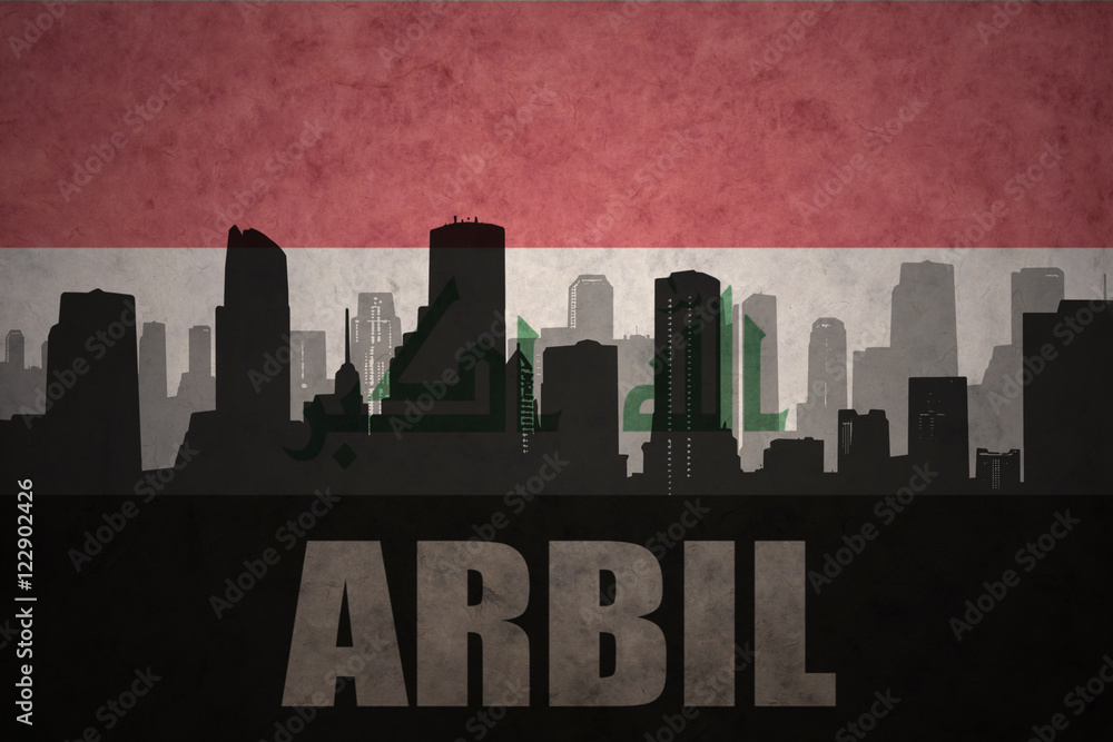 abstract silhouette of the city with text Arbil at the vintage iraqi flag background