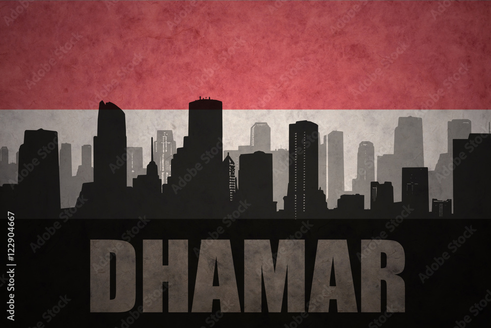 abstract silhouette of the city with text Dhamar at the vintage yemen flag background
