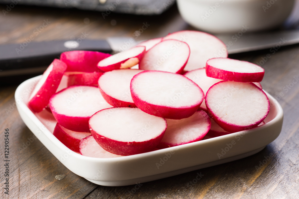 sliced radishes on wood sliced radishes on wood