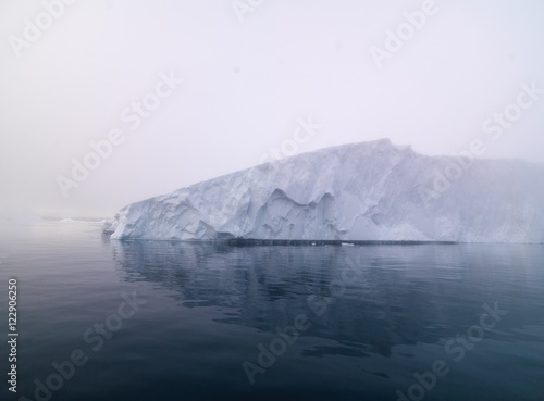 Big icebergs are ont he arctic ocean in Greenland