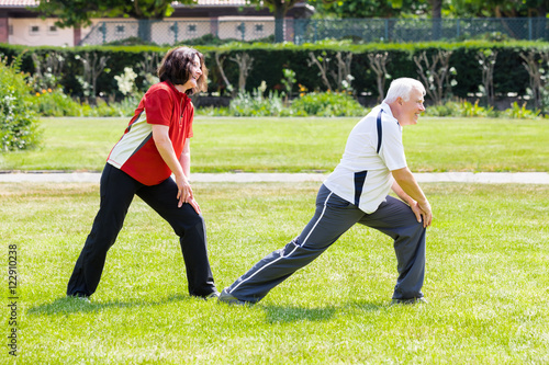 Couple Doing Work Out In Park