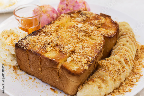 Honey toasts with banana , vanilla and strawberry ice-cream - dessert