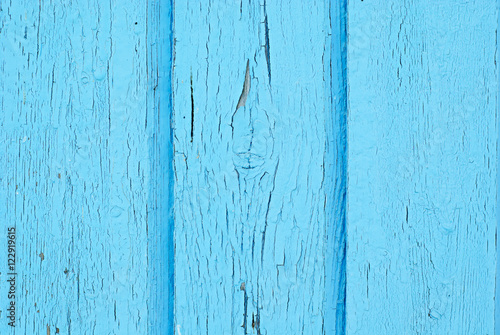 Old wooden light blue rustic background, peeling paint, texture