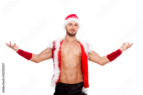Sexy male posing in xmas costume, isolated on white