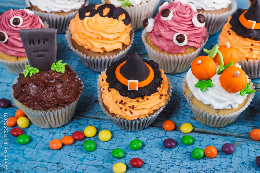 Halloween cupcakes with colored decorations