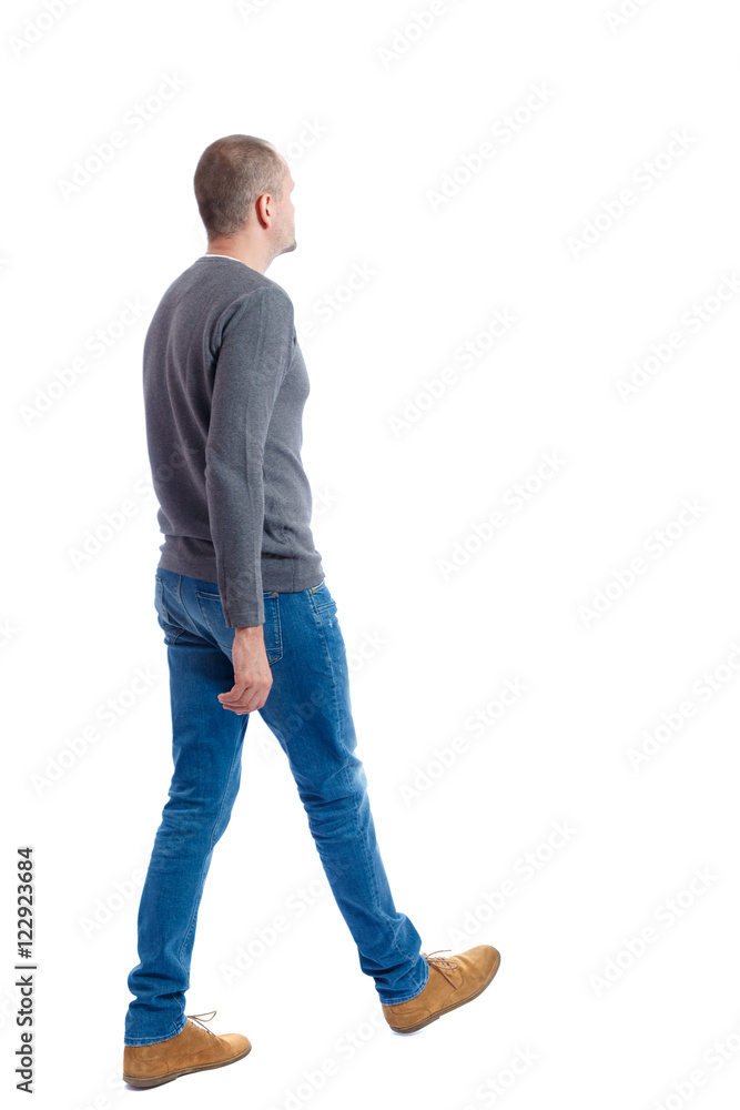 Back view of going handsome man. walking young guy . Rear view people collection. backside view of person. Isolated over white background. A guy in a gray sweater passes. Back view of going handsome man. walking young guy . Rear view people collection. backside view of person. Isolated over white background. A guy in a gray sweater passes.