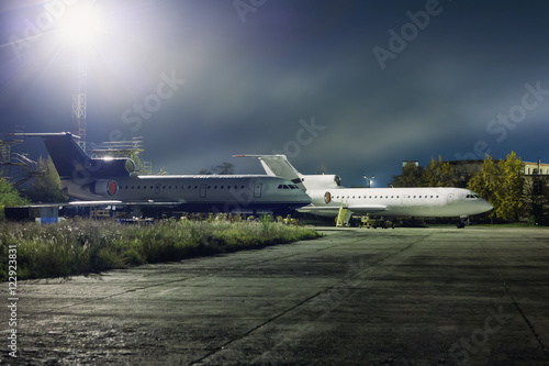 Planes maintenance on the aviation technical base at night
