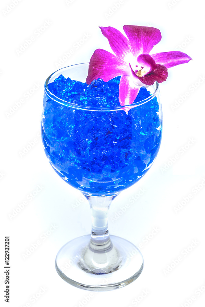 Beautiful flowers in wine glass with hydrogel isolated on white