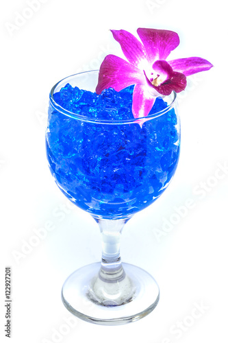 Obraz na płótnie Beautiful flowers in wine glass with hydrogel isolated on white w salonie