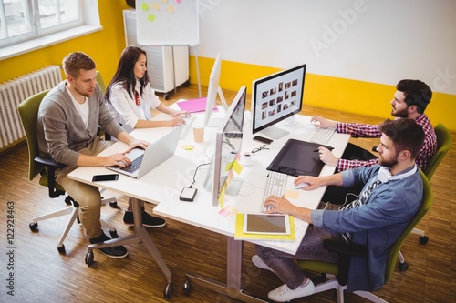 High angle view of editors working at creative office