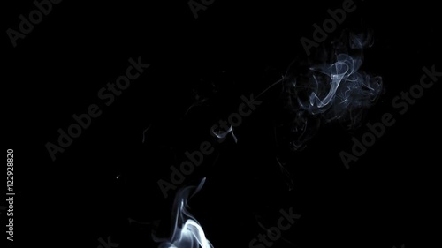 Messy puff of crisp smoke dissipating into black studio shot