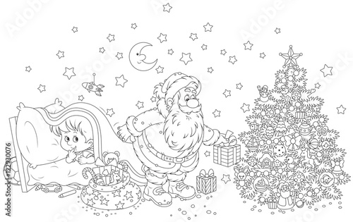 The night before Christmas, Santa Claus putting his holiday gifts under a decorated tree for a little boy who spying behind him from under a blanket
