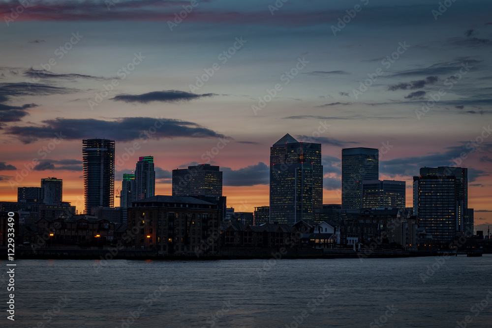 Silhouette of Canary Wharf at sunset a major business district in Tower Hamlets, East London. It is one of the United Kingdom's main financial centre and contains many of Europe's tallest buildings